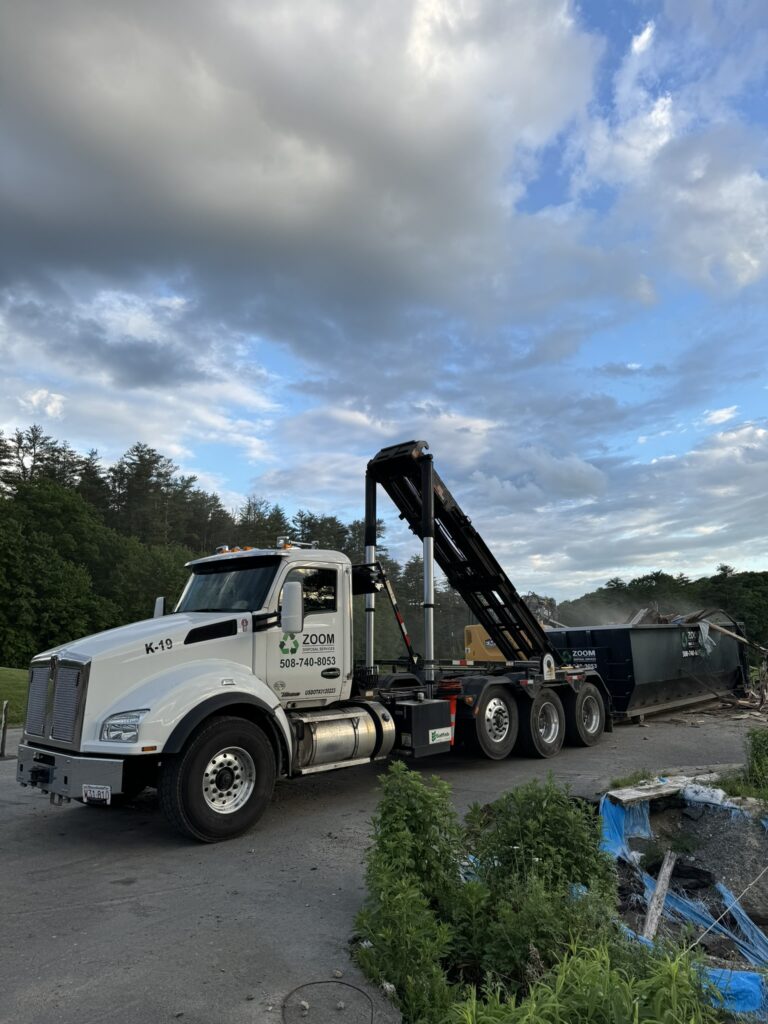 Dumpster in driveway during a renovation project