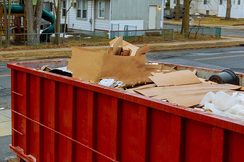Dumpsters being full with garbage container trash